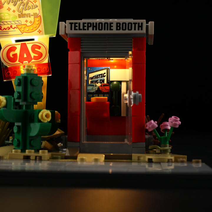 Side view of Lumibricks L9082 showing LED-lit windows and retro telephone booth signboard