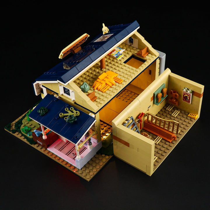 Overhead view of the Lumibricks F9080 stable interior showing buildable fences, roof structure, and interactive play zone without horse figure.