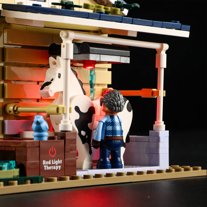 Play scene from Lumibricks Horse Stable F9080 featuring a white horse drinking water and a rider minifigure standing beside the stable